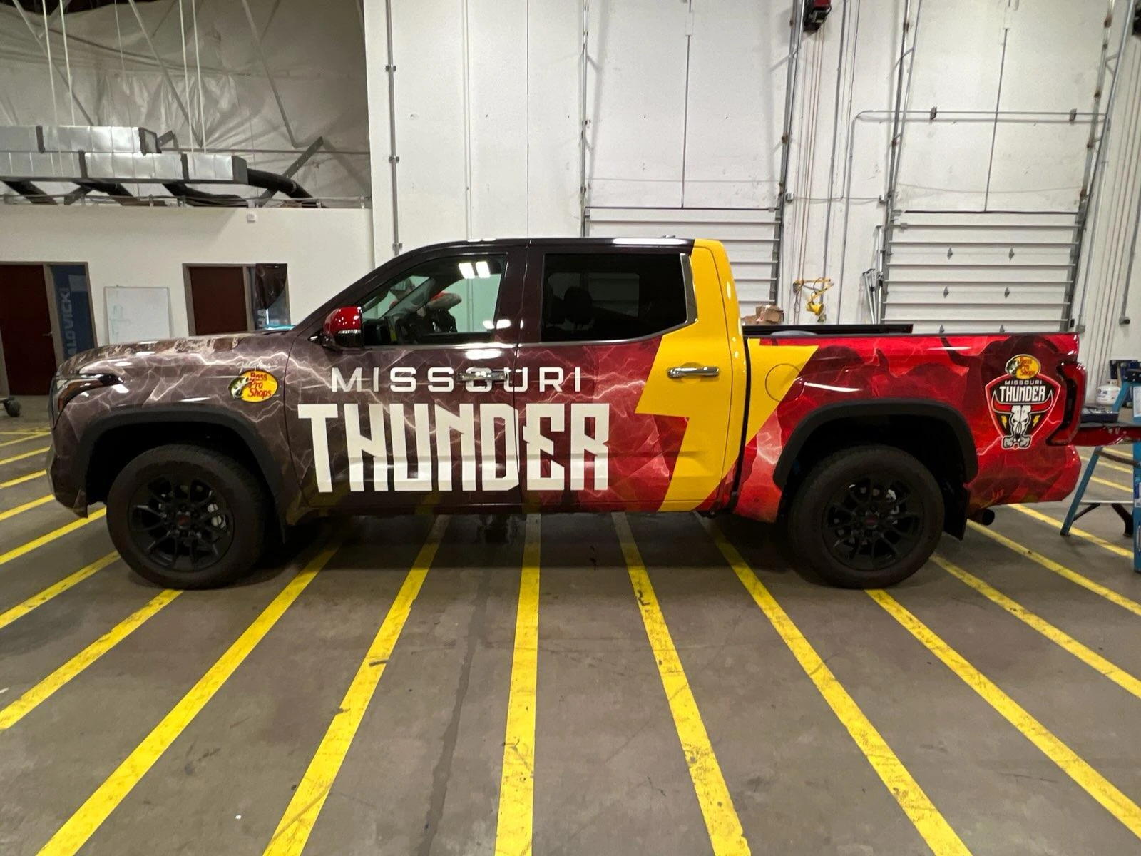 Side view of the Missouri Thunder branded pickup truck.