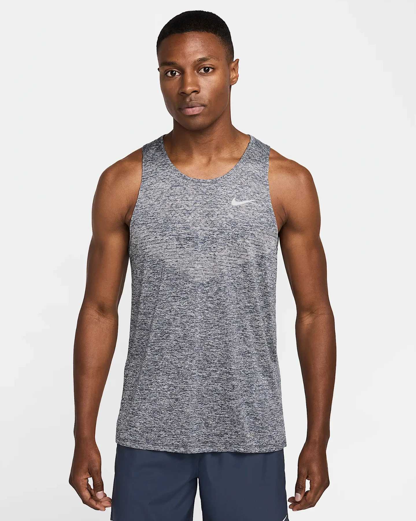 Source apparel photograph with a gray patterned tank top.